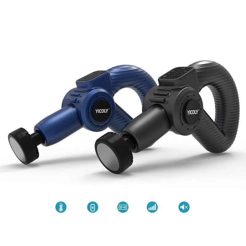 Black smart muscle massage gun with display, attached massage head, and additional heads on a table.
