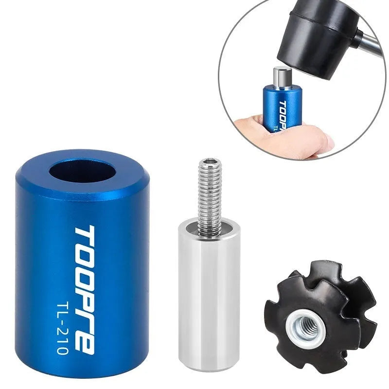 Blue sunflower driving tool for bicycle bowl group hanging core installation, made from aluminium alloy and stainless steel, on a workbench.