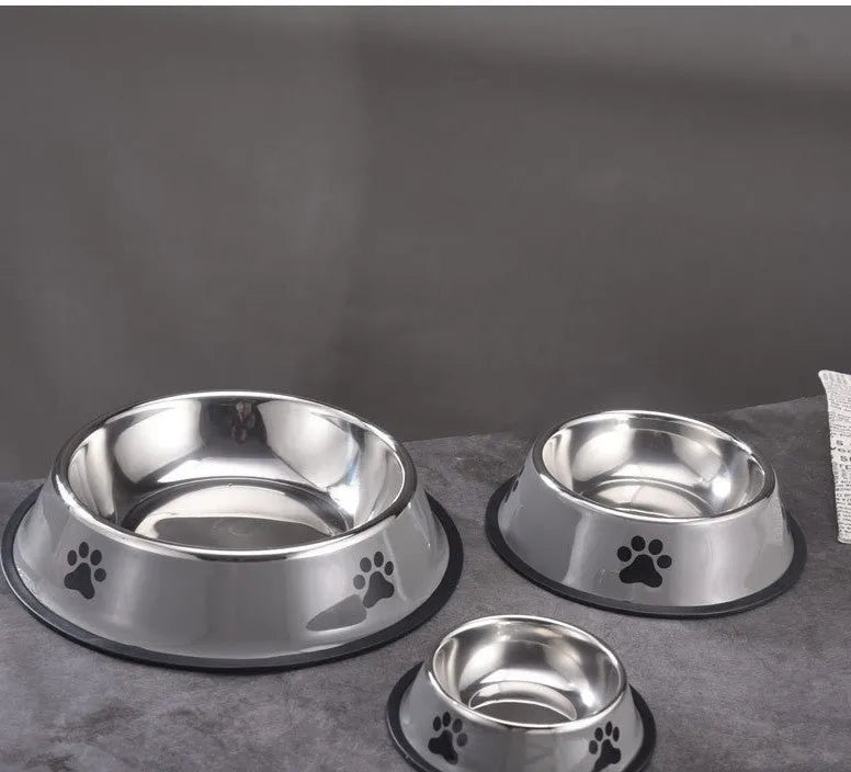 Printed non-slip stainless steel pet bowl for dogs and cats in gray, shown on a floor