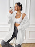 Women's dark green acrylic cardigan with two pockets and long sleeves.