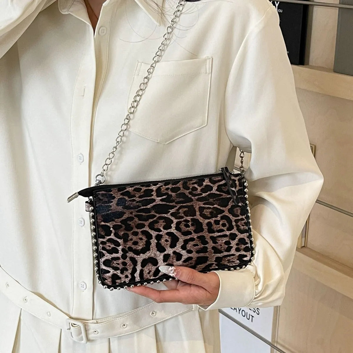 Women's casual crossbody underarm bag in brown PU with chain detail and horizontal square shape