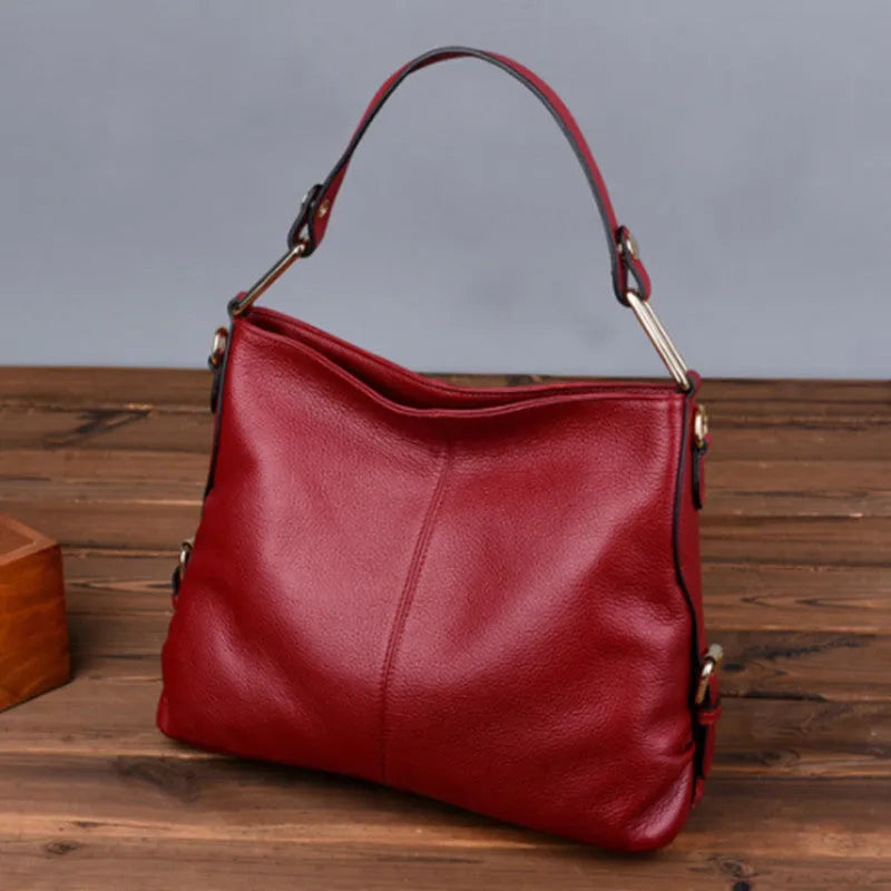 Genuine leather vertical crossbody bag in a square shape with an external sandwich pocket.