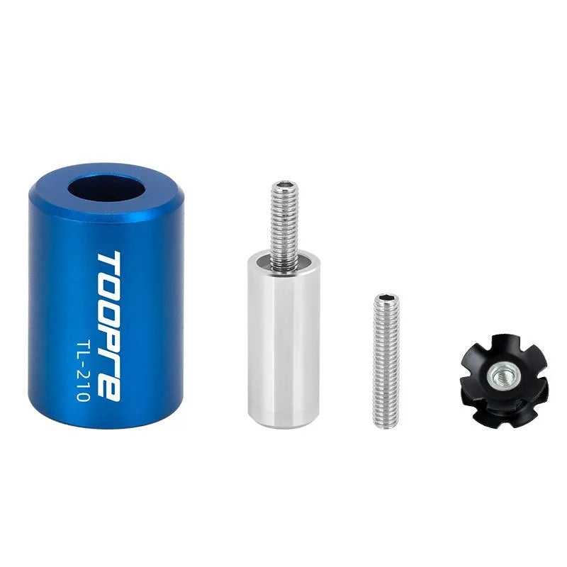 Blue sunflower driving tool for bicycle bowl group hanging core installation, made from aluminium alloy and stainless steel, on a workbench.