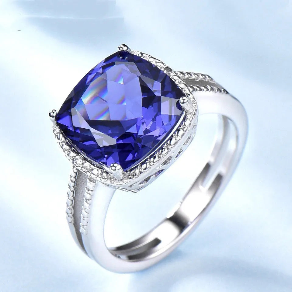 925 Sterling Silver women's ring with blue Tanzanite gemstone on a silver band