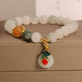 Ice jade colour women's bracelet with xiangyun buckle and pearl details.