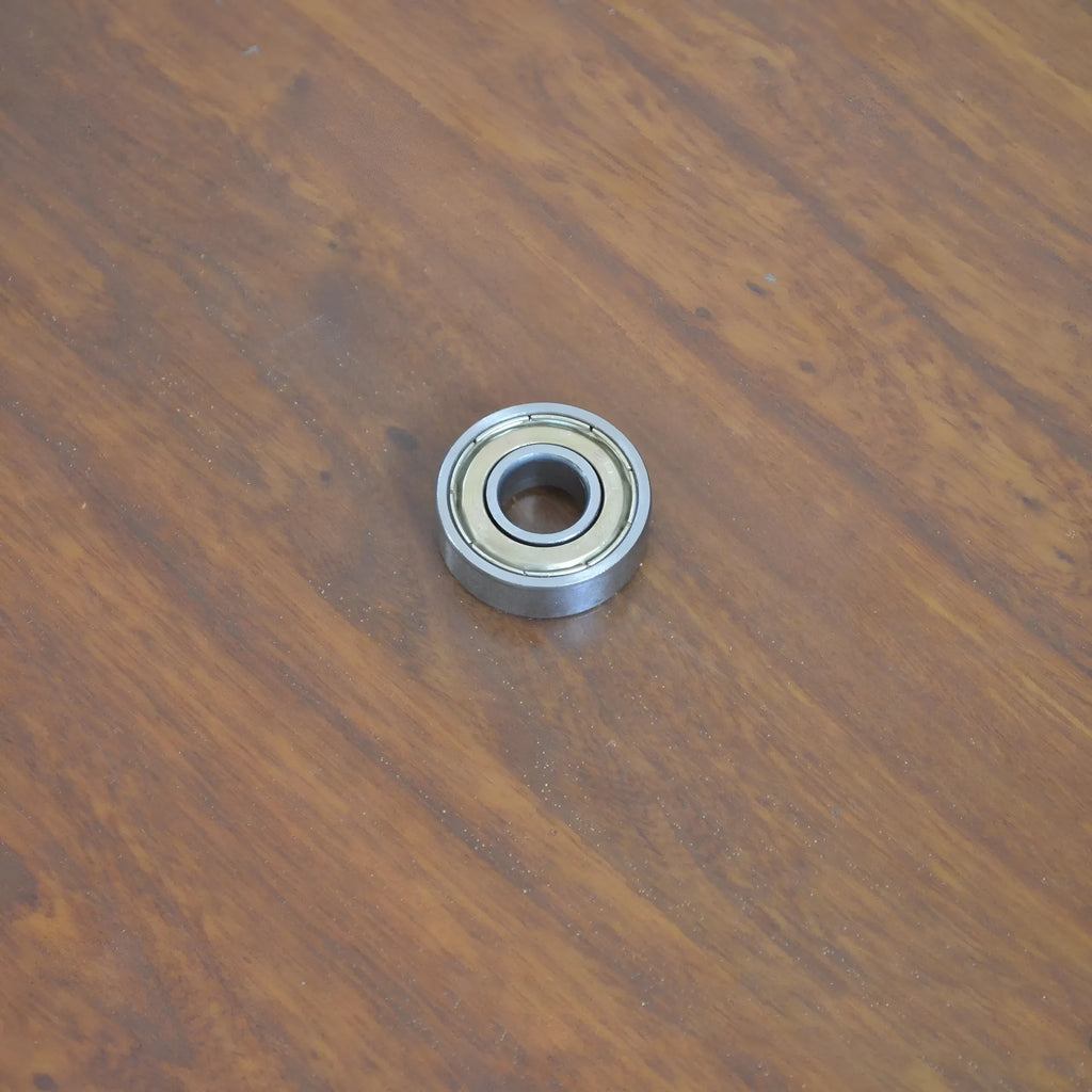Carbon steel bearing 6000zz with dimensions 10x26x8mm on a white background