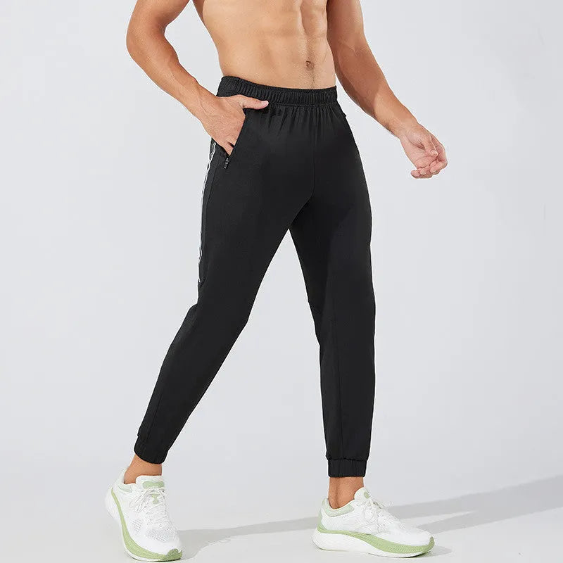 Men's black running trousers with polyester fabric and mid waist design for exercise
