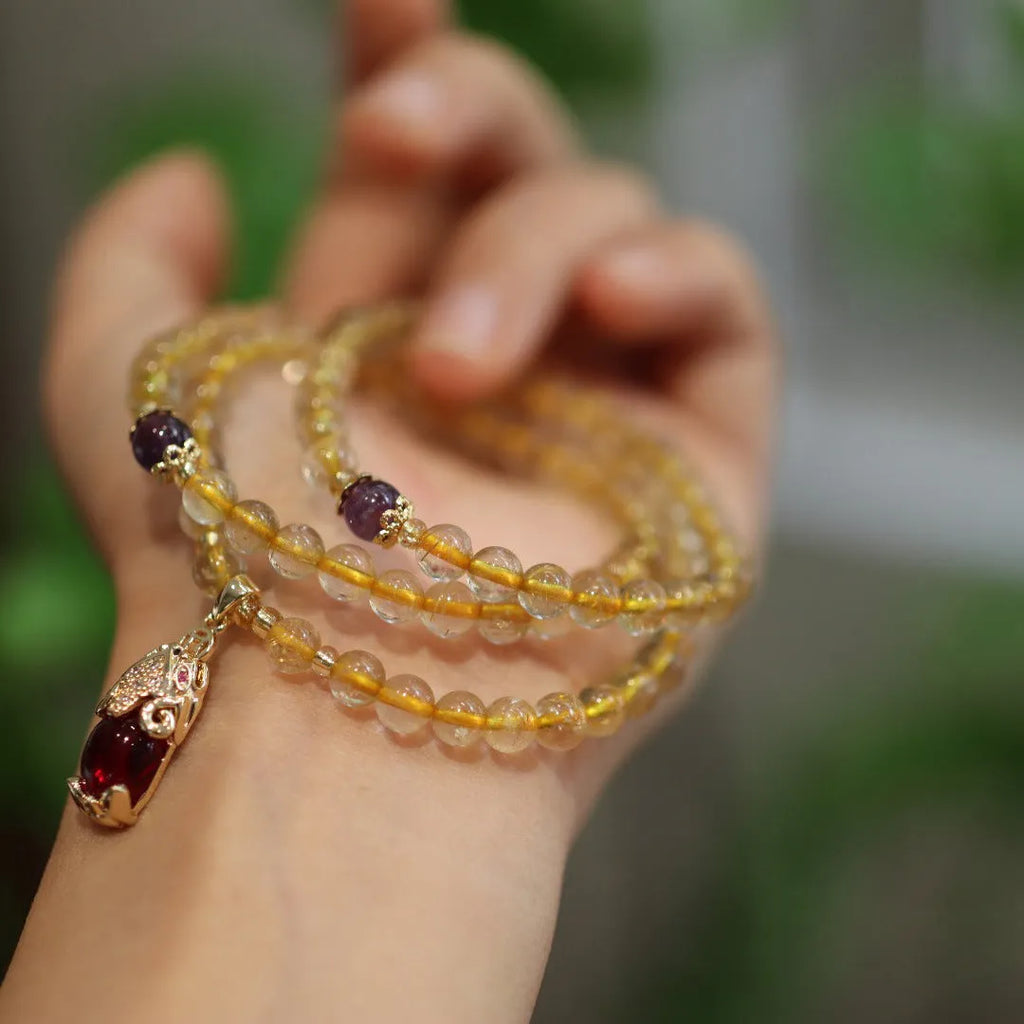 Brazilian rutilated quartz bracelet with three-circle gold chain and Chinese-style design