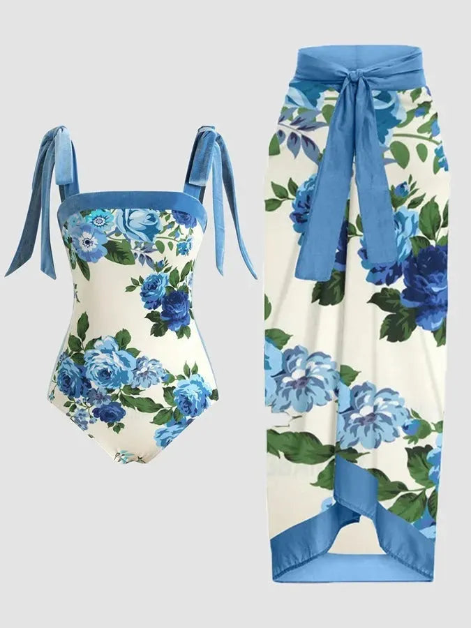 Women's floral printed two-piece swimsuit with matching skirt on a mannequin