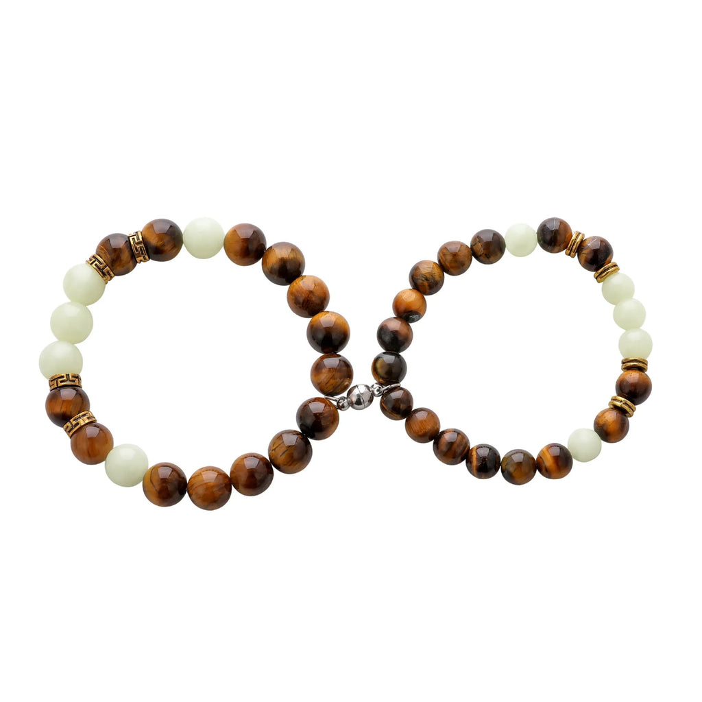 Amber Y552 luminous geometric couple bracelet on dark background showing glow effect