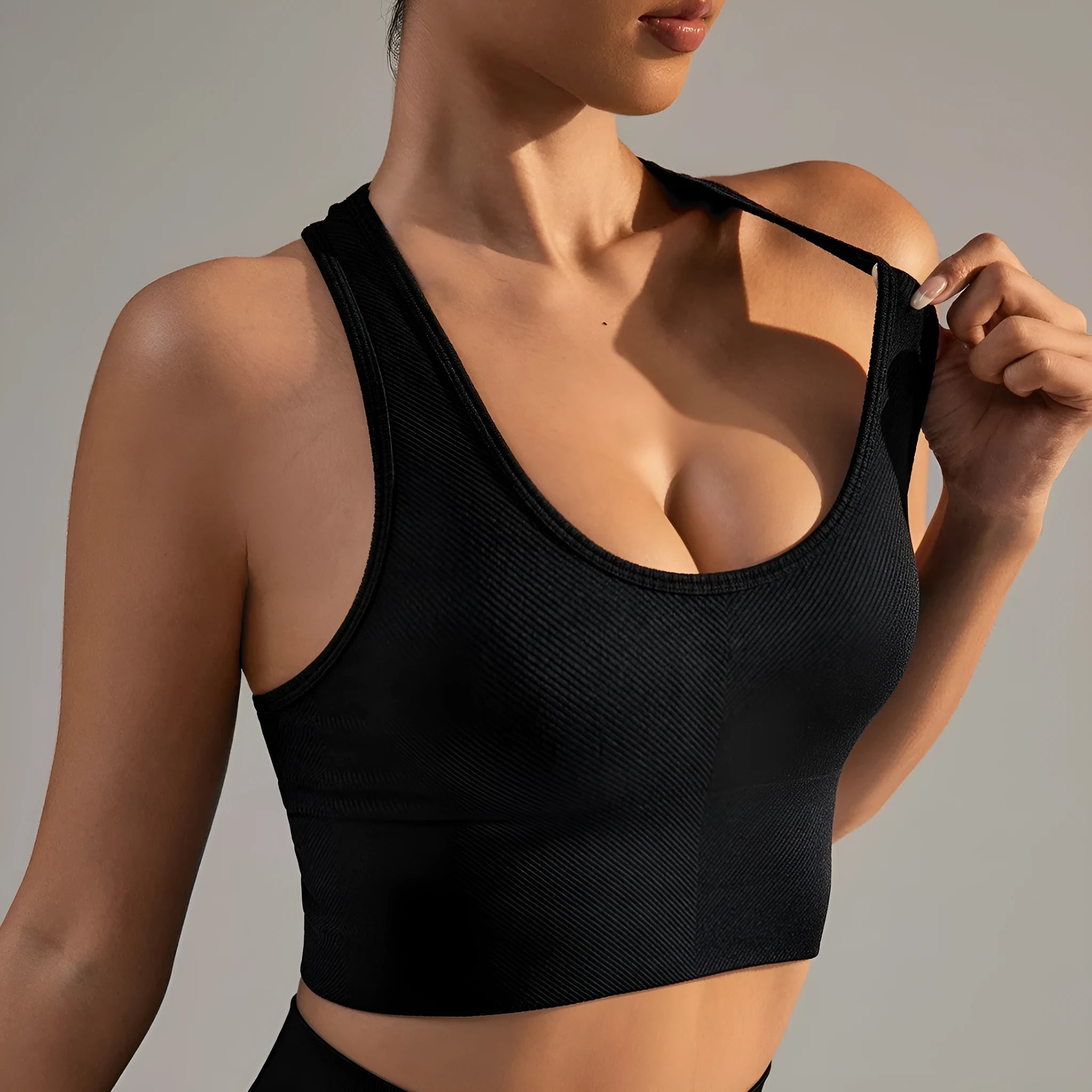 Quick-drying breathable sports bra for women in black with cross back design