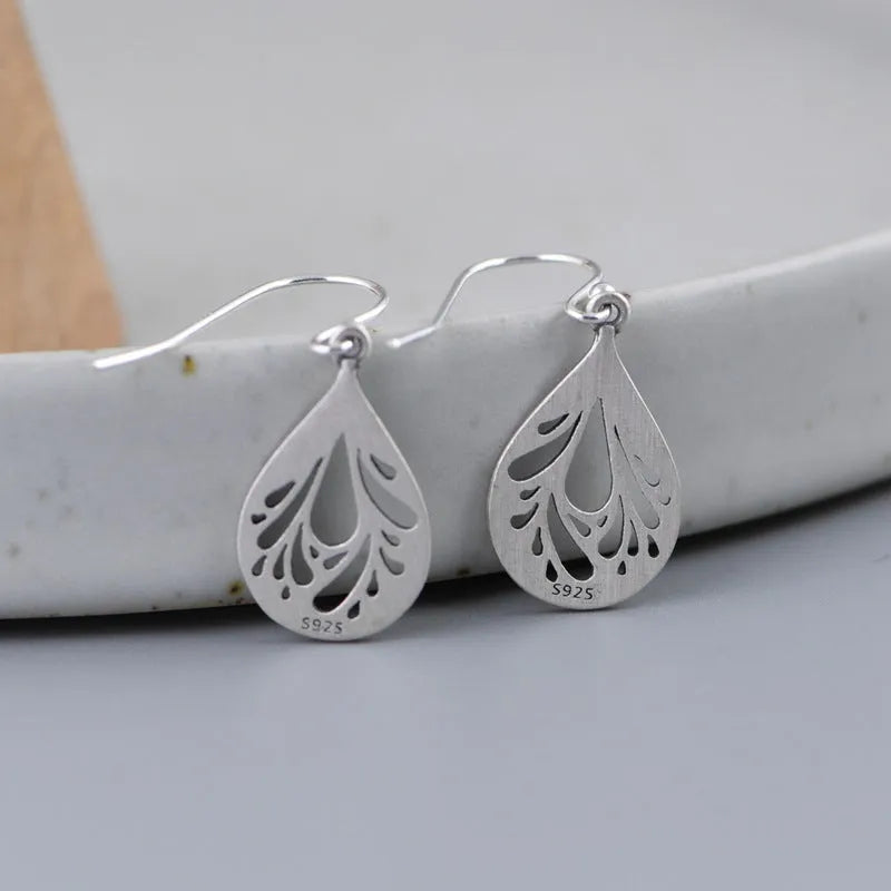 Retro 925 silver hollow water drop shape earrings for women, small stud style with hand ground finish