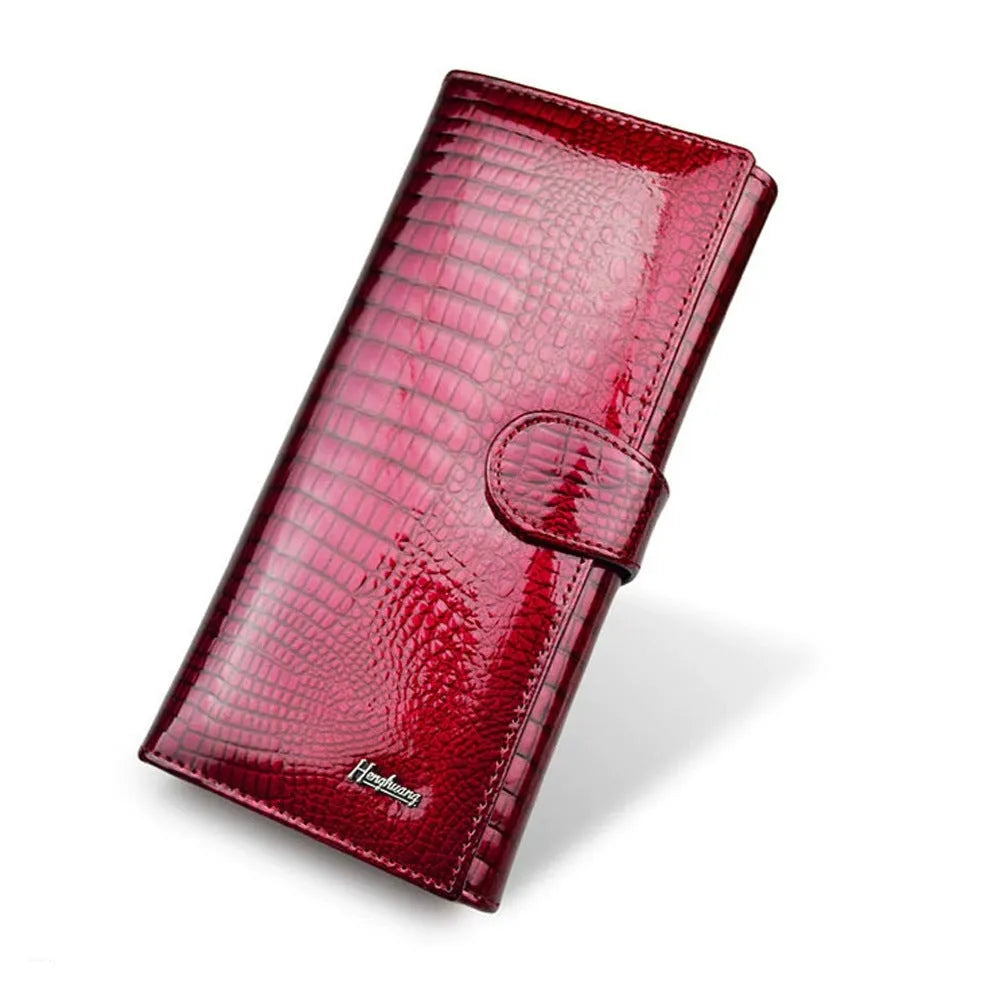 Red crocodile pattern patent leather women's coin purse with pigskin lining.