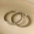 Copper circle earrings with 40mm diameter and electroplated gold or silver finish