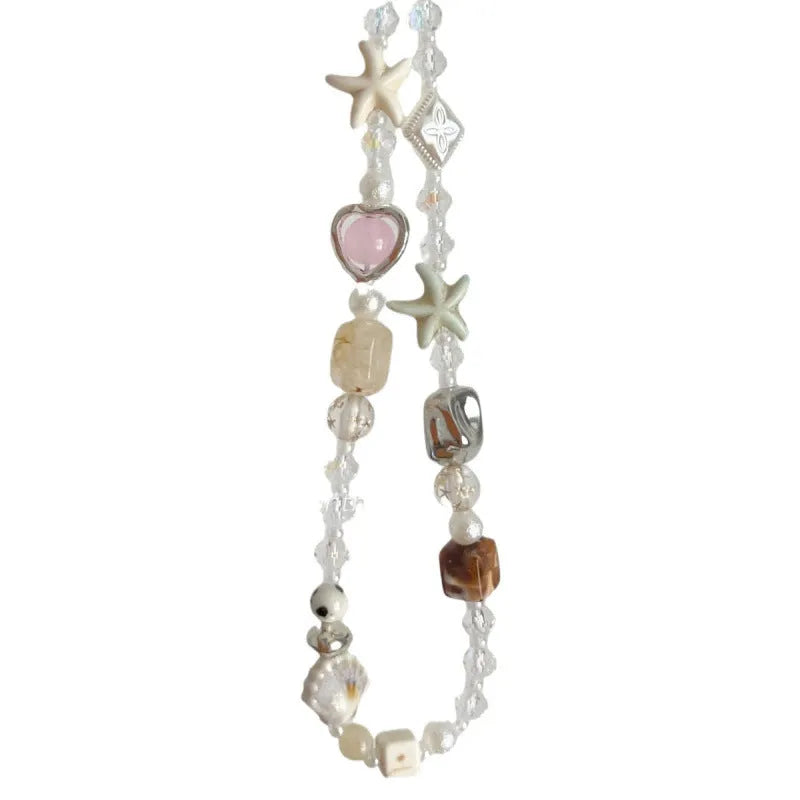 Island Sweetheart bohemian beaded alloy mobile phone charm on pastel background