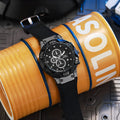 Men's sports quartz watch with 45mm round alloy case and black silicone strap on a white background