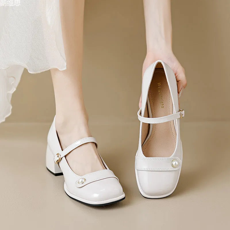 Plus size patent leather pumps with chunky block heels in apricot colour, showing square toe design and buckle fastening