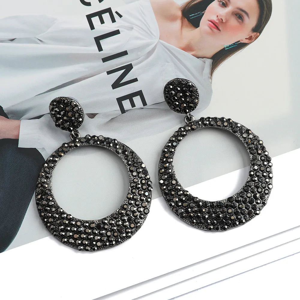 Colourful cartoon style metal earrings with round diamond shapes and large pendant design