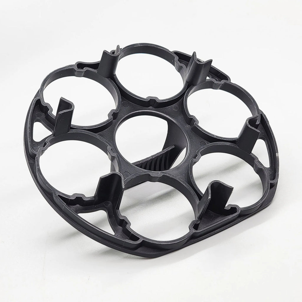 Black plastic egg storage rack with modern design on a kitchen counter