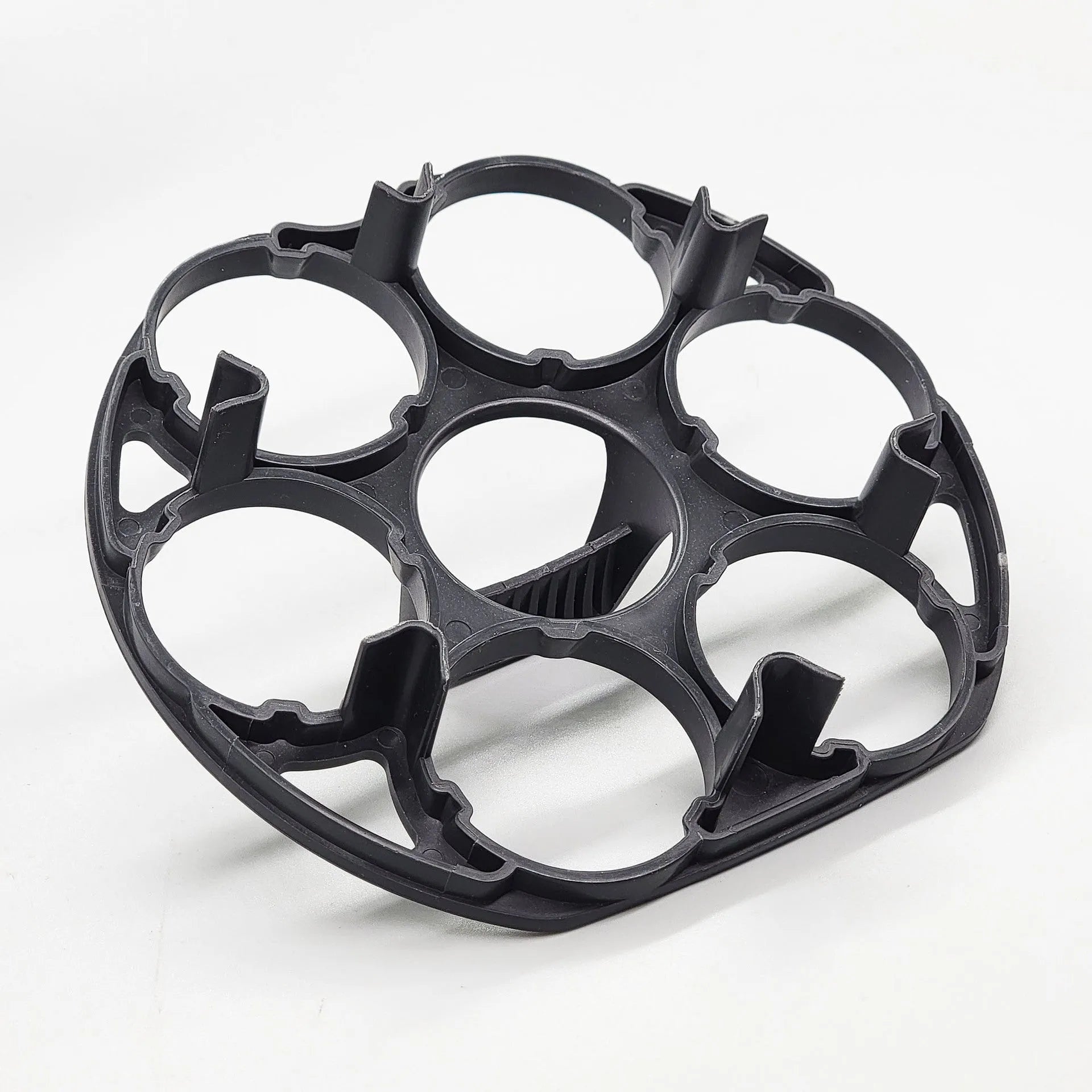 Black plastic egg storage rack with modern design on a kitchen counter