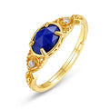 Silver ellipse ring with deep blue lapis lazuli stone in a geometric Japanese style design.