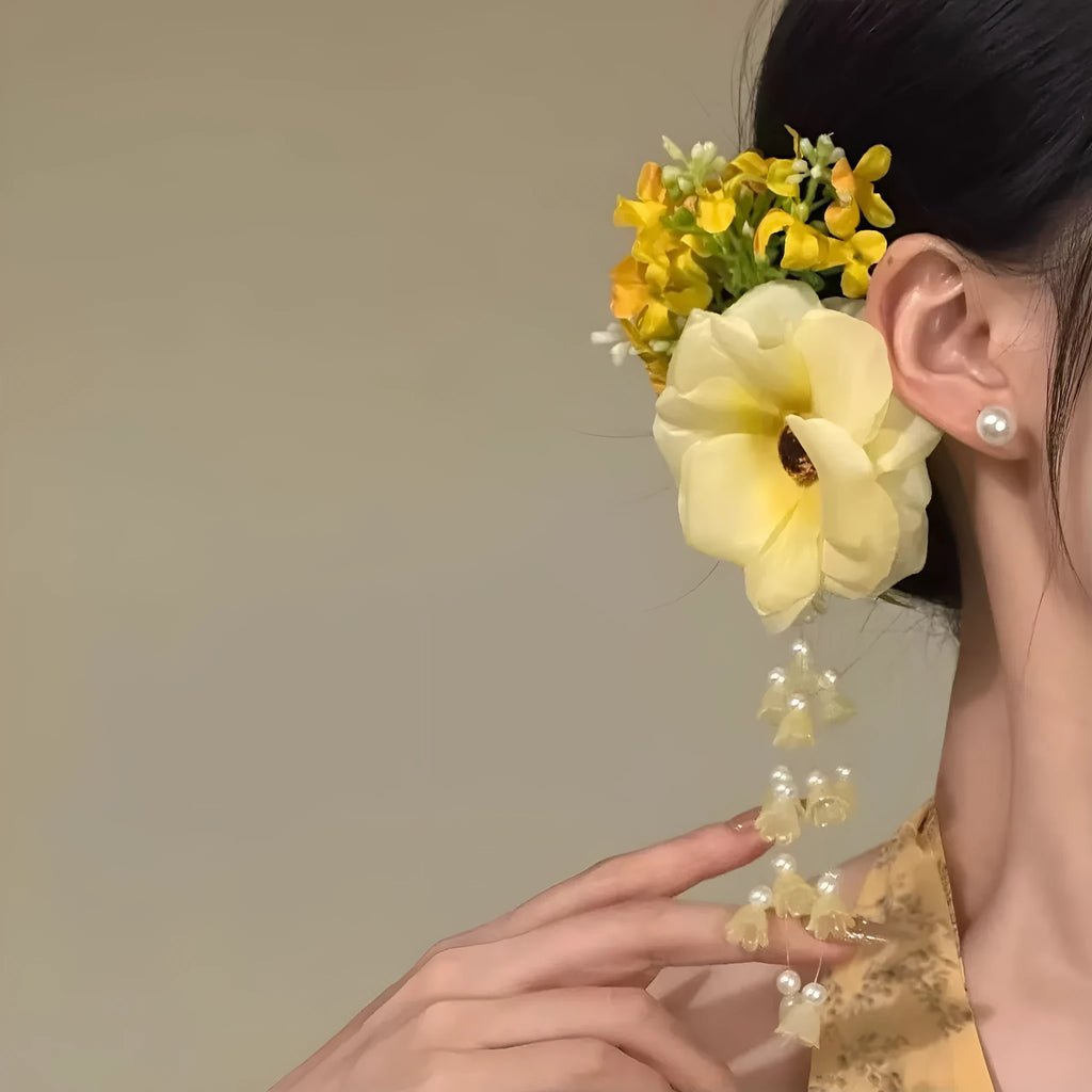 Yellow and purple floral tassel side hair clip for women on holiday style.