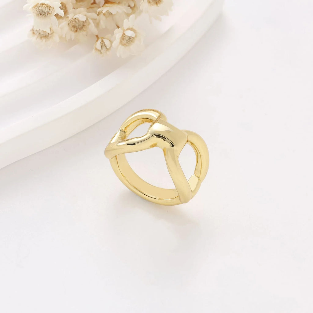 Titanium steel butterfly hollow ring in gold colour on a white background