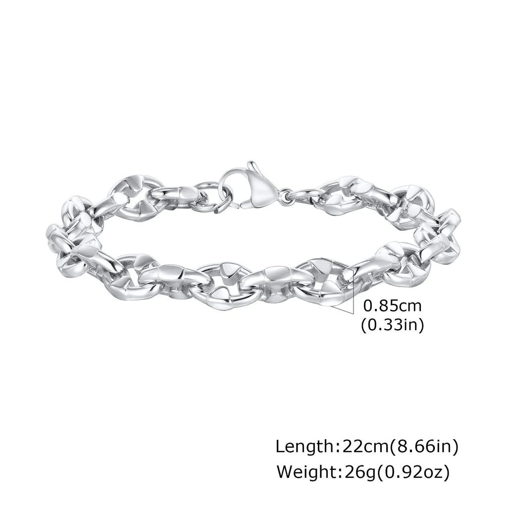 Men's stainless steel handmade geometric chain bracelet in steel colour on a wrist.