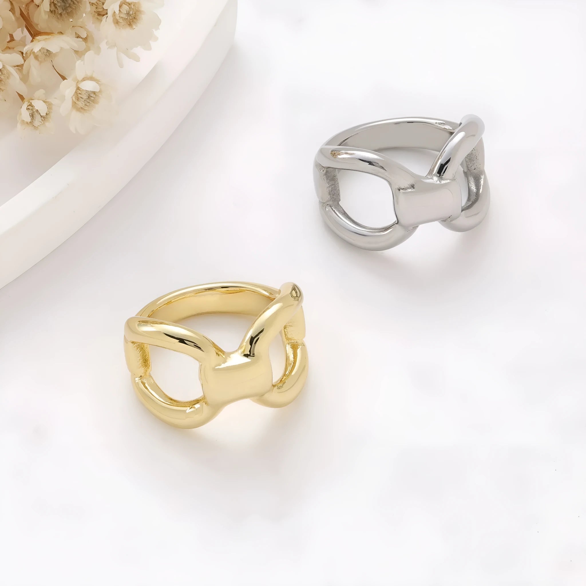 Titanium steel butterfly hollow ring in gold colour on a white background