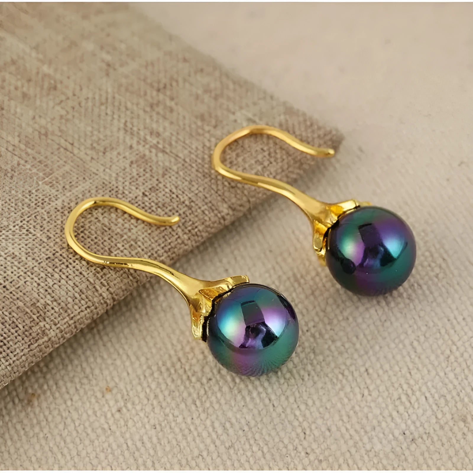 A pair of gold-coloured retro-style fashion earrings for women