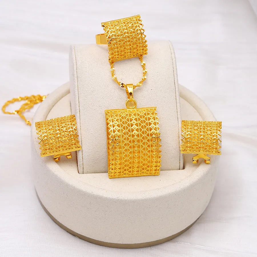 Women's bridal wedding gold jewelry set including copper necklace, earrings, and ring in natural style golden finish