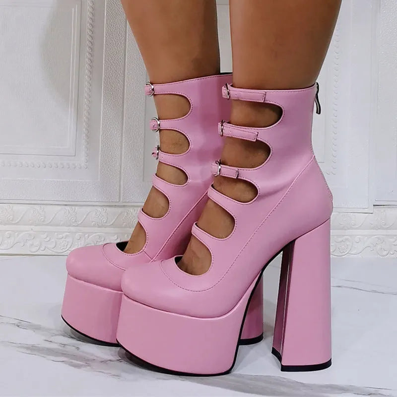 Women's black patent leather platform high heel boots with a serpentine belt ankle buckle.