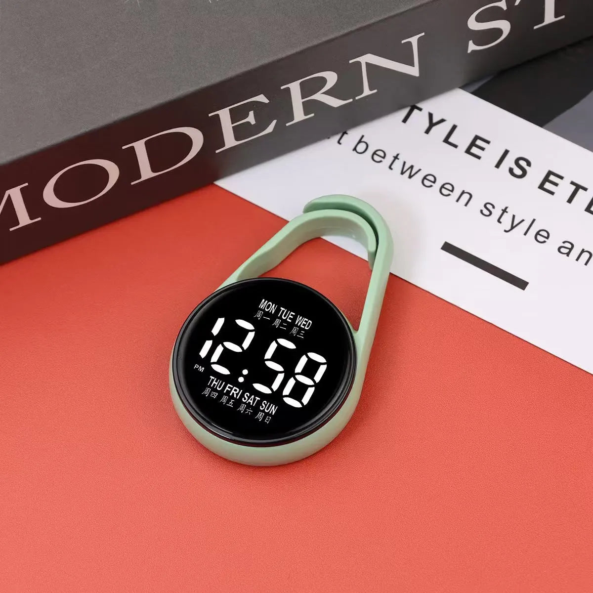 Mini digital electronic watch with luminous week display on a plastic strap, shown in multiple colour options.