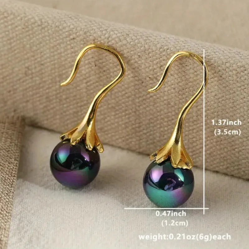 A pair of gold-coloured retro-style fashion earrings for women