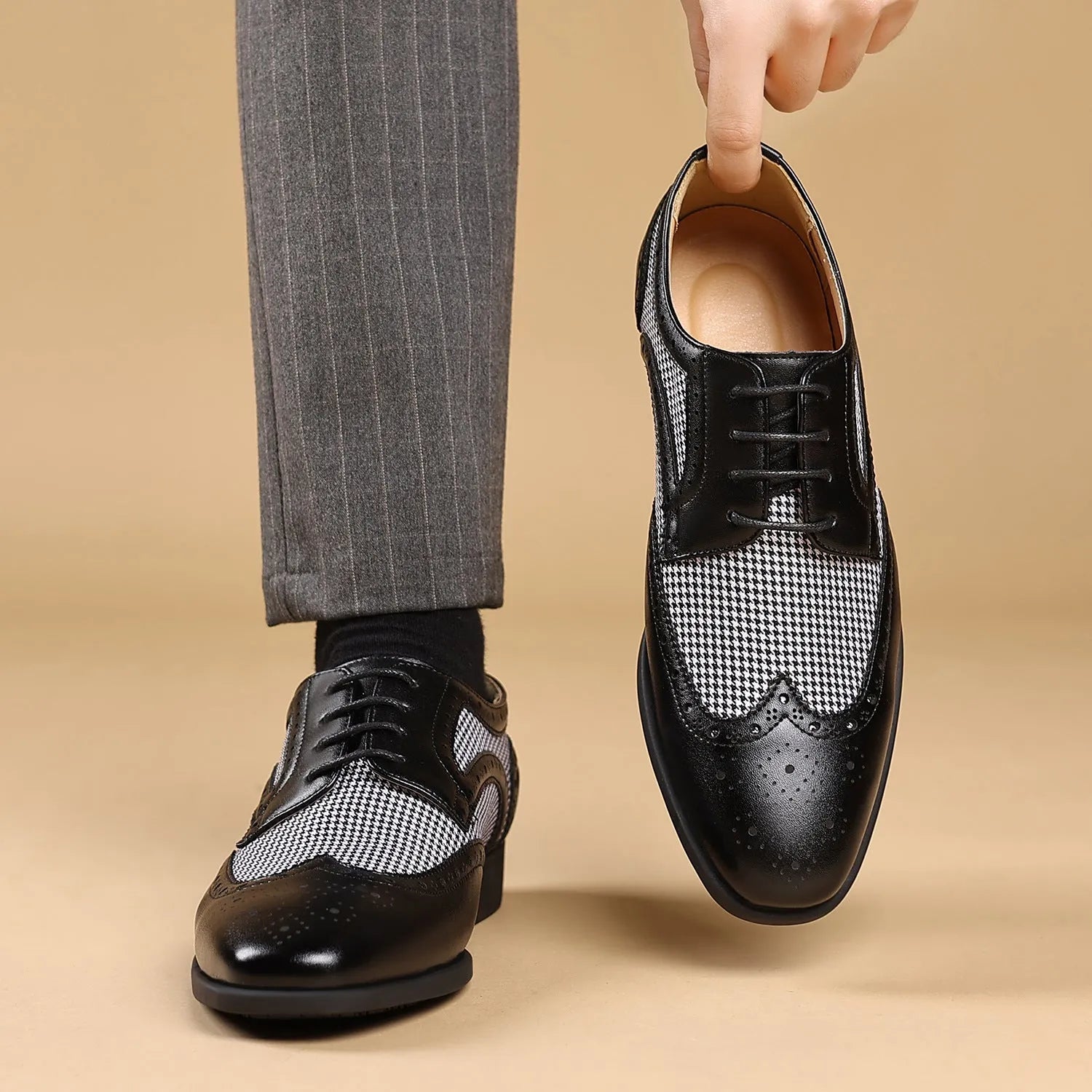 Men's black houndstooth patterned canvas lace-up casual shoes with a rubber sole.