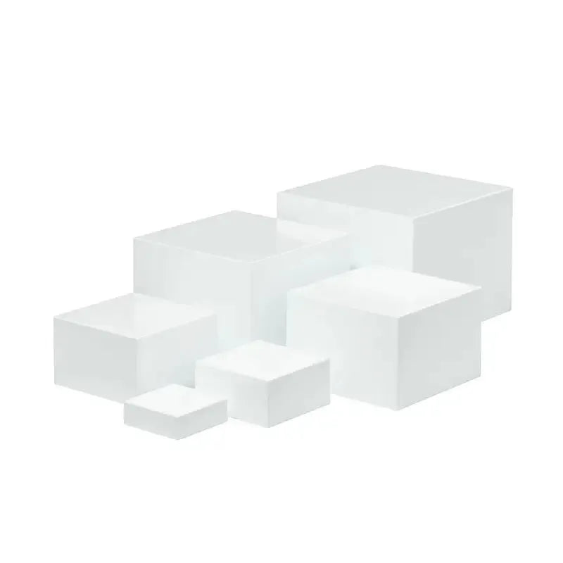 White plastic modular dessert display stand with six interlocking cube pieces arranged in a tiered configuration.