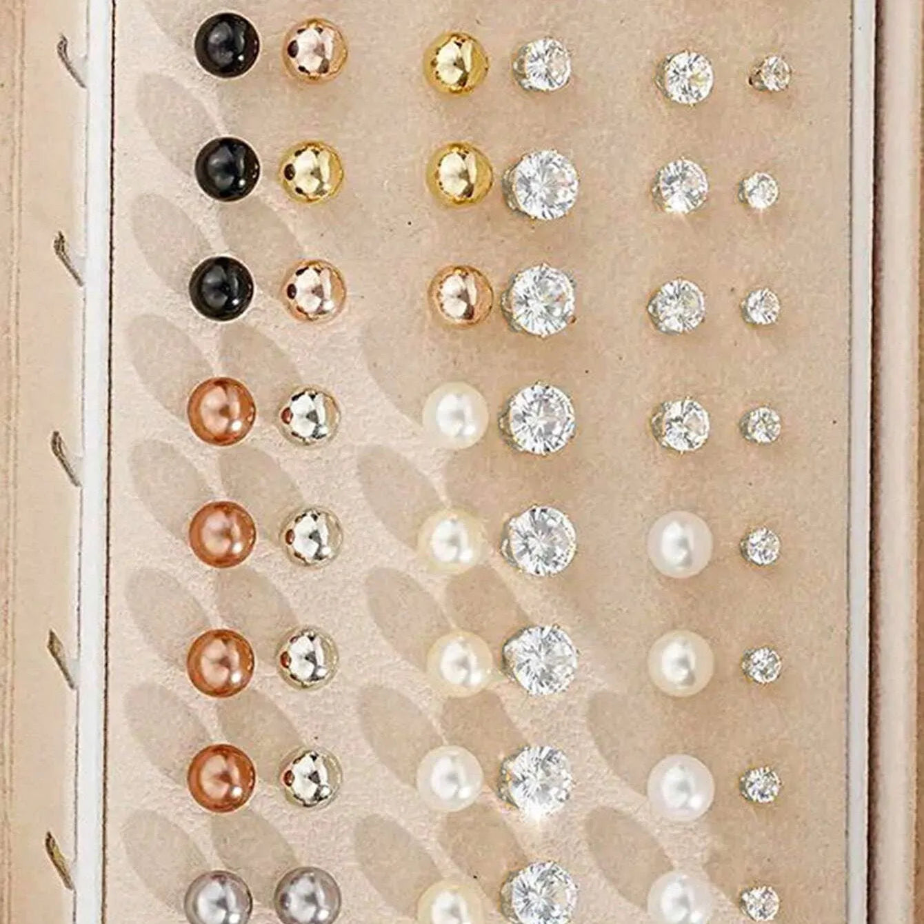 108-piece set of gold and yellow geometric round alloy pearl earrings for women on a plain background.