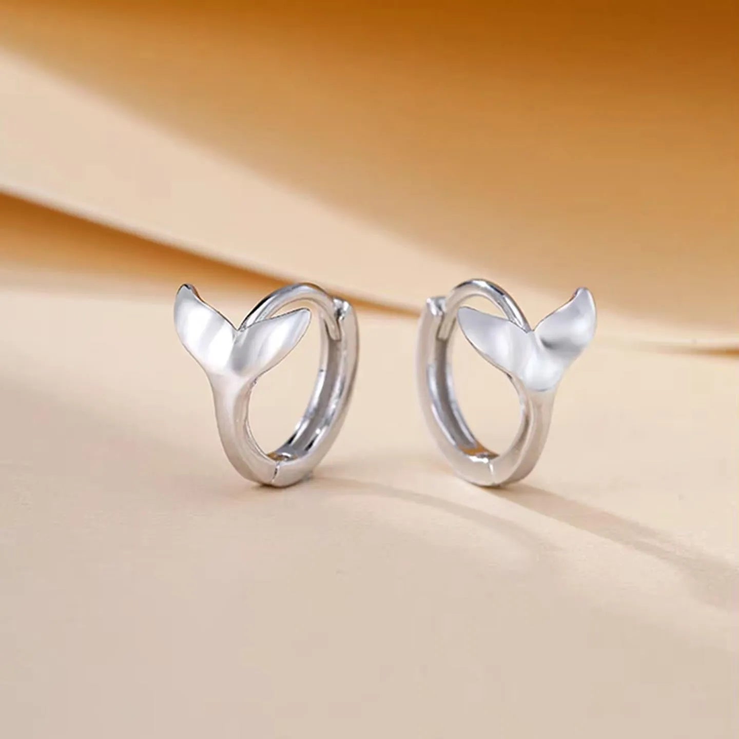 Women's fashion fishtail earrings in white gold and yellow gold colour options
