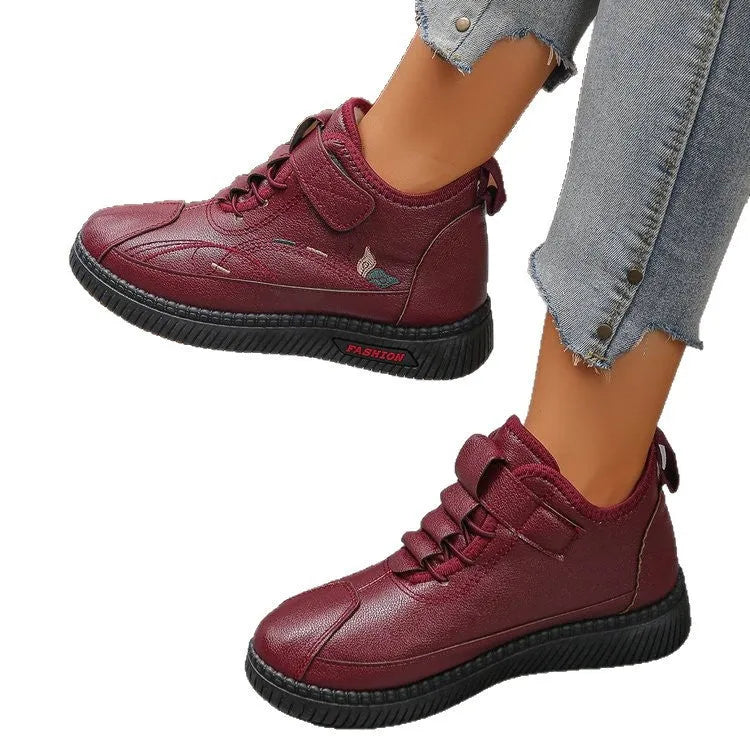 Women's black velvet plimsoll with non-slip rubber sole and hollow-out detailing
