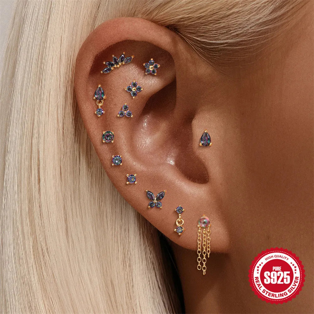S925 sterling silver thread piercing earring with a shiny rainbow stone in a gold setting