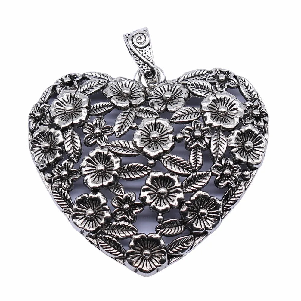 Hollow flower love pendant in ancient silver alloy finish, 67x58mm, on white background