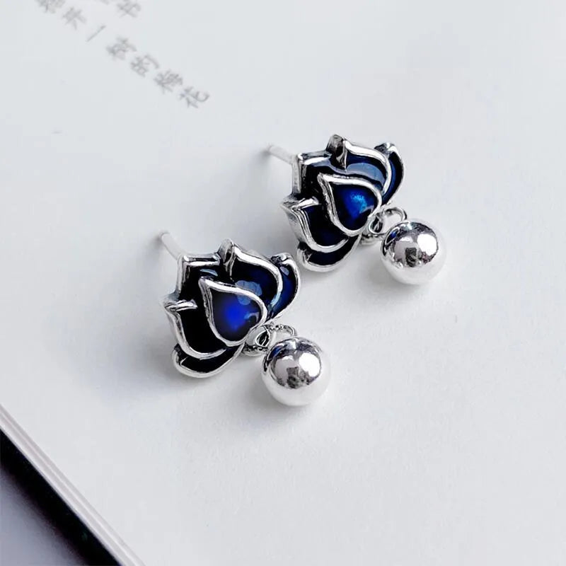 Women's lotus seedpod earrings with tassel accents in silver needle alloy
