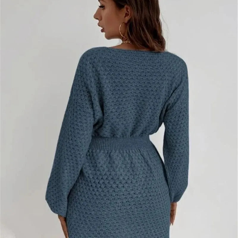 Blue women's knitted dress with hand-crocheted flowers, round neck, fitted waist, and long sleeves