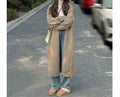 Loose fit women's knitted cardigan sweater in thick chenille fabric, medium length.