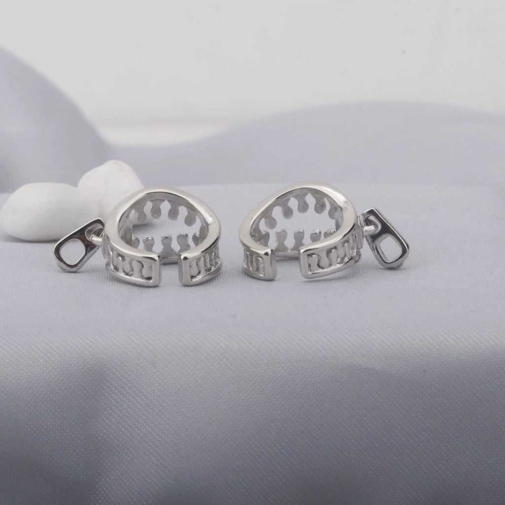 A pair of geometric copper clip-on earrings with a simple line design, colour ES862.