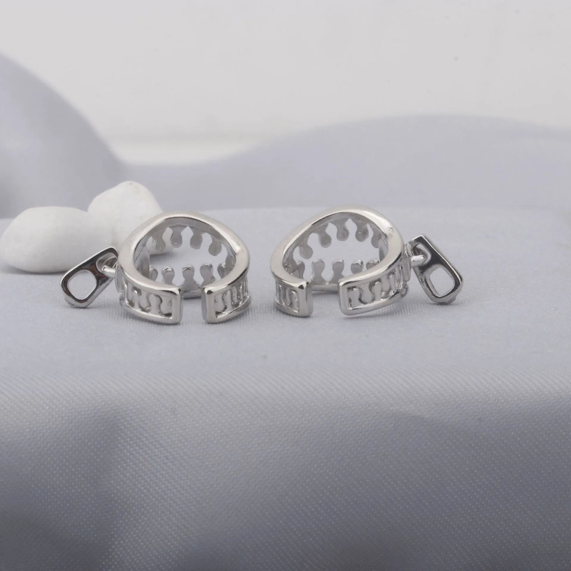 A pair of geometric copper clip-on earrings with a simple line design, colour ES862.