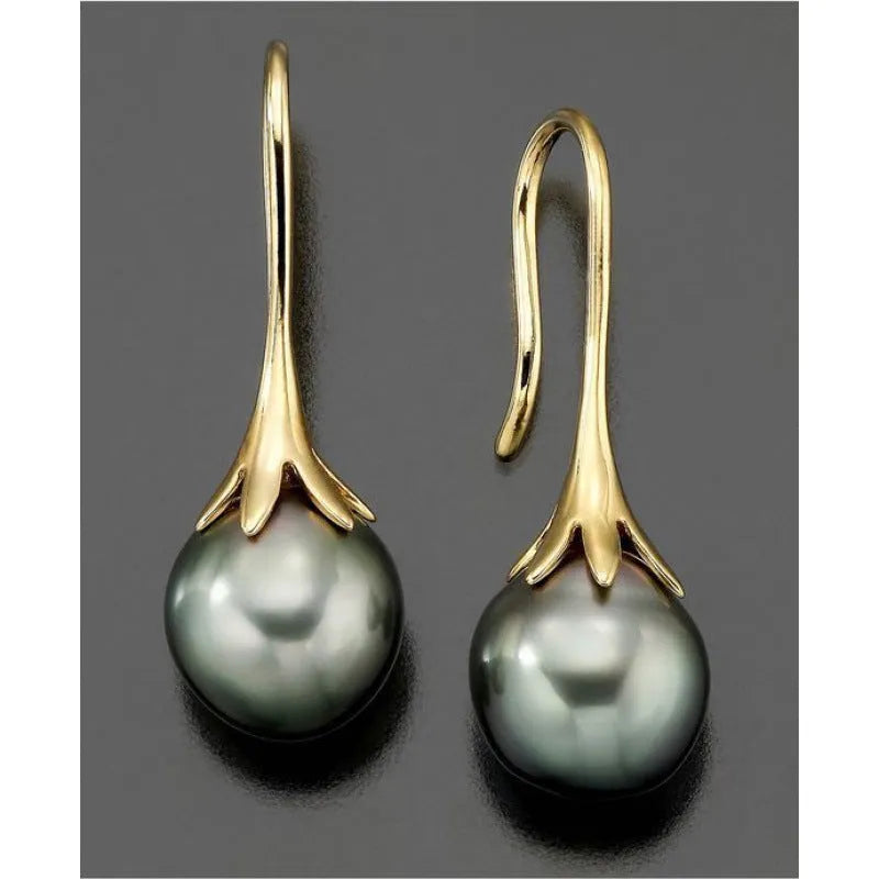 A pair of gold-coloured retro-style fashion earrings for women
