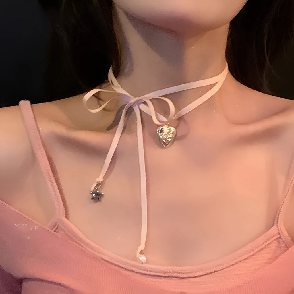 Women's alloy ribbon love pendant fashion necklace on a clavicle chain, available in 33 colours.
