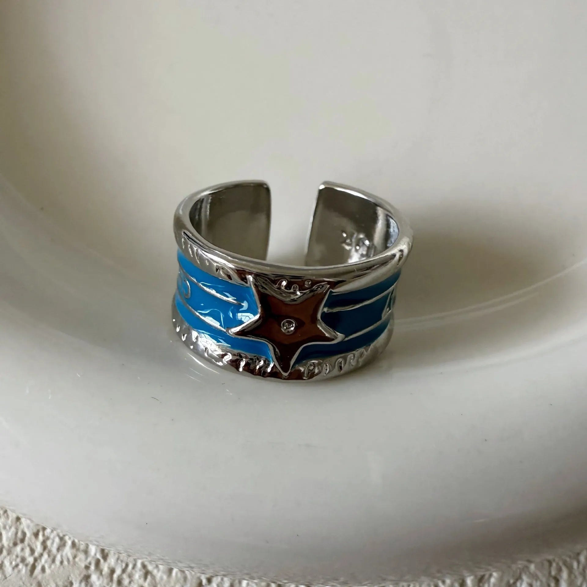Adjustable copper ring with a distressed geometric drop oil design in a choice of colours.