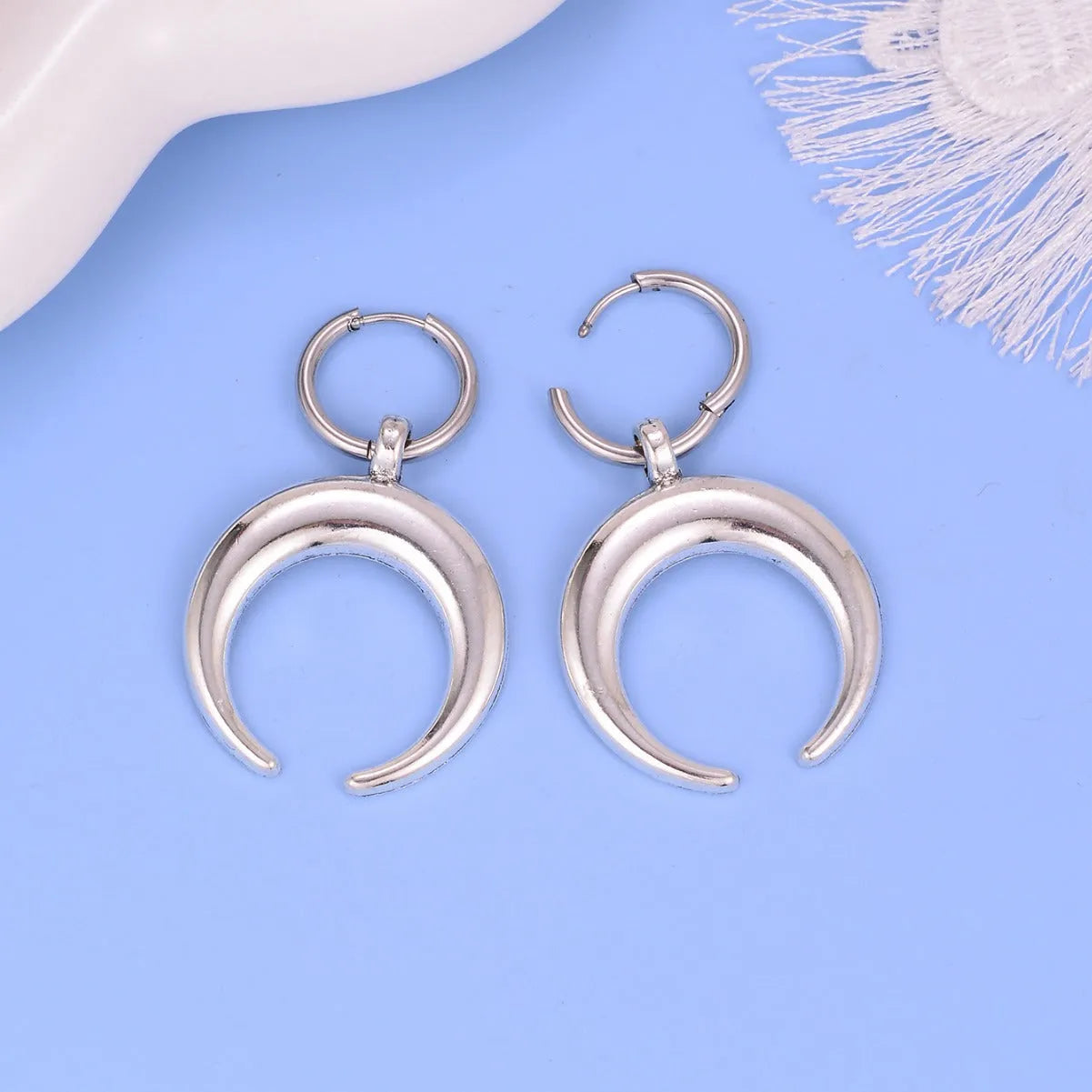 Vintage gothic moon hoop earrings with silver electroplated finish and clip-on fitting